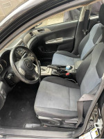 Interior view of 2009 Subaru Impreza Outback Sport with comfortable seats and functional dashboard.