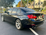 2014 BMW 328I in excellent condition with 103K miles, showcasing sleek design and clean interior.