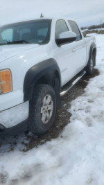 2007 GMC Sierra 1500 Crew Cab 4x4, white truck parked in snow, available for sale.