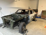 1969 Plymouth Roadrunner project car with light rust, stored in garage, ready for rebuild and restoration.