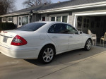 2007 Mercedes Benz E350 4Matic sedan in white with saddle interior, showing rear and side view.