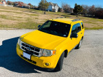 2011 Ford Escape in yellow, 105,000 miles, spacious, perfect for families or work use.