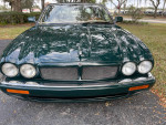 Front view of a well-maintained 1996 Jaguar XJR with a supercharged engine in beautiful condition, showcasing its sleek design.