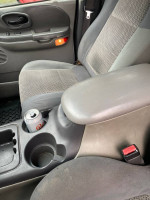 Interior view of a 2002 Ford F-150 showing seats and center console.