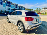 2015 Mercedes-Benz GLA 250 4MATIC SUV parked with stylish design, showcasing rear view and clear sky.