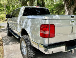 2006 Lincoln Mark LT 4x4 Crew Cab with a 6” suspension lift in mint condition, parked outdoors.