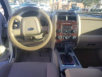 Interior view of a 2009 Ford Escape XLT, featuring a stylish dashboard and comfortable seating.