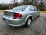 2005 Dodge Stratus SXT in Satin Jade Pearl, showing rear view with clean lines and good tires.