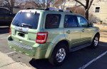 2010 Ford Escape Limited Hybrid in green, showcasing leather seats and backup camera features.