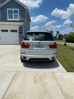 2012 BMW 35d in great condition, showing rear view with luxury features and spacious design.