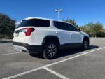 2021 GMC Acadia SLE FWD parked, showcasing its sleek design and excellent condition, ideal for family trips.