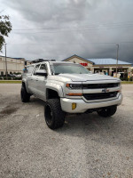 2016 Chevrolet Silverado 1500 LT 4WD parked, showcasing rugged design and off-road capabilities, with clean title and maintained mileage.