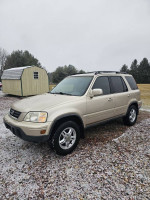 2001 Honda CR-V SE AWD in beige color, parked outdoors, showcasing its well-maintained exterior and design.