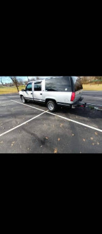 1994 GMC Suburban in parking lot, reliable with new parts, great for winter driving