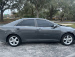 2013 Toyota Camry SE in gray, showing side view with clean interior and 100K miles for sale at $4500.