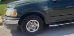 2001 Ford F-150 truck, green color, displaying side view and wheel, ready for mechanics special.