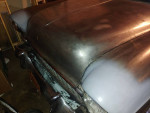 Close-up view of a classic 1955 Chevrolet Station Wagon with a metallic finish and original styling.