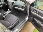 Interior view of a 2011 Subaru Outback with comfortable seating and modern dashboard features.