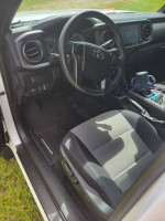 Interior view of a 2021 Toyota Tacoma TRD Offroad, showcasing seats and dashboard with modern features.
