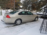 2012 Chevrolet Impala LT in a snowy environment, showcasing great condition and well-maintained features.