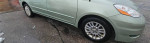 2008 Toyota Sienna XLE 7-passenger van in green, showcasing wheel and side profile details