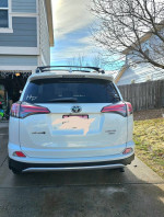 2018 Toyota RAV4 Limited FWD parked at home, showcasing low mileage and well-maintained condition.