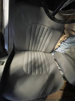 Interior view of the refurbished leather seat in a 1960 Jaguar MK2 car for sale.