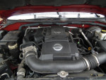 Engine view of a 2007 Nissan Pathfinder, showcasing a V6 4.0L motor with 99,000 miles.