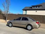 Side view of a 2007 Toyota Corolla in nice condition parked on a driveway
