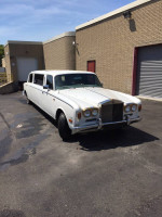 1972 Rolls-Royce Silver Shadow Super Stretch Limousine in white with gold trim, showcasing its length and elegance.