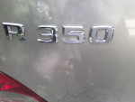 Close-up of the Mercedes-Benz R 350 badge on a silver 2010 model with 81,000 miles.