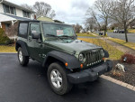 2007 Jeep Wrangler Sport for sale with new tires and brakes, parked in residential area.