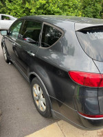 2007 Subaru Tribeca parked, AWD, showing minor wear, needs towing for engine issues.