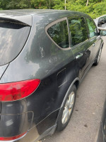 2007 Subaru Tribeca B9 AWD parked in a lot, showing minor wear, ideal for mechanics or budget buyers.