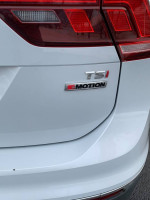 Close-up of 2018 Volkswagen Tiguan TSI badge and 4Motion emblem on rear of the vehicle.