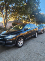 2007 Mazda CX-9 Sport SUV in good condition, parked outdoors with trees nearby and a second vehicle in the background.