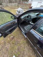 Interior view of a Mercedes-Benz with leather seats, automatic windows, and air suspension, ready for sale.