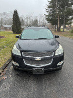 Front view of a 2009 Chevrolet Traverse LTZ AWD in black, showcasing its stylish design and equipped features.