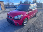 2013 Kia Soul in red, showing clean body and alloy wheels, ready for sale with 86,800 miles and features like Bluetooth.