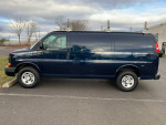 2016 Chevrolet Express cargo van with ladder racks, 72k miles, excellent condition, parked on asphalt.