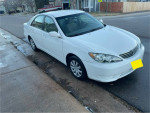 2006 Toyota Camry LE for sale, white color, parked on the street with 119,000 miles on the odometer.