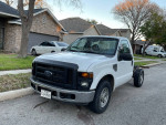 2008 Ford F-250 Super Duty truck with 82,000 miles, in good condition, parked on a residential street.