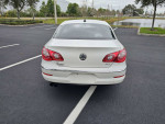 Rear view of a clean 2011 Volkswagen CC with low mileage parked in a lot, featuring sleek design and chrome accents.