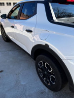 2022 Hyundai Santa Cruz SEL AWD in outstanding condition, showcasing its sleek Ice White exterior and alloy wheels.