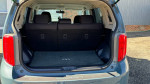 Interior view of 2010 Scion xB showing spacious trunk area and rear seats.