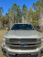 Front view of a 2018 Ford F-150 King Ranch in mint condition, showcasing chrome grille and robust design.