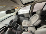 Interior view of a 2004 Saturn Vue with Honda engine, showing front seats, dashboard, and controls.