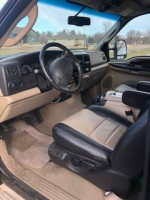 Interior view of a 2005 Ford Excursion Eddie Bauer with leather seats and dashboard.