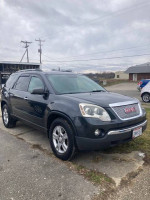 2011 GMC Acadia SUV with V6 engine, backup camera, and spacious interior for comfortable seating.