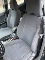 Interior view of a well-maintained 2004 Subaru Impreza with gray fabric seats.